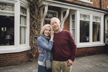 75% of Americans Are Worried About Rising Housing Costs in Retirement. Here Are Some Tips to Save.: https://g.foolcdn.com/editorial/images/767818/senior-man-and-woman-smiling-and-holding-each-other-in-front-of-a-house-home-couple-30-year-mortgage.jpg