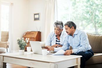 Social Security: 1 Tax Rule That Could Shrink Your Future Benefits: https://g.foolcdn.com/editorial/images/720573/two-older-people-sitting-on-a-couch-looking-at-a-laptop-copy.jpg
