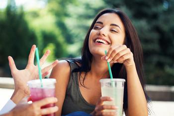 Should You Buy This High-Yield Beverage Stock?: https://g.foolcdn.com/editorial/images/770614/young-woman-laughing-and-drinking-soda.jpg