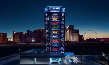 Carvana Could Earn $180 Million This Quarter, According to 1 Wall Street Analyst: https://g.foolcdn.com/editorial/images/773600/carvana-car-vending-machine-at-night-with-logo-on-top-is-carvana.jpg