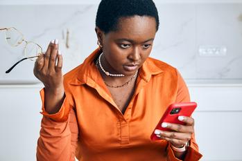 2 Stocks to Buy Near Their 52-Week Lows: https://g.foolcdn.com/editorial/images/844124/person-using-a-smartphone.jpg