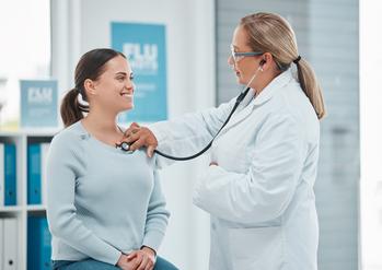Is This Blue Chip Dividend Stock a Buy for Growth Investors?: https://g.foolcdn.com/editorial/images/742845/a-doctor-examines-a-patient-with-a-stethoscope.jpg