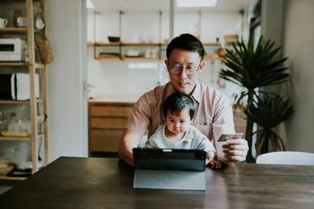 The Old-School Financial Stock That's Winning the Digital Revolution: https://g.foolcdn.com/editorial/images/832662/father-and-child-in-front-of-a-computer.jpg