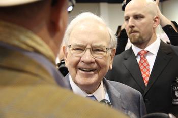 Have $1,000? 2 Warren Buffett Stocks to Buy Right Now: https://g.foolcdn.com/editorial/images/687526/warren-buffett-standing-in-between-two-other-people.jpg