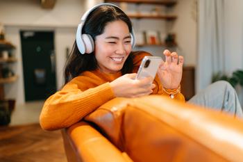 Spotify Stock Has 25% Upside, According to 1 Wall Street Analyst: https://g.foolcdn.com/editorial/images/774260/smiling-woman-in-headphones-listens-to-music-on-a-smartphone.jpg