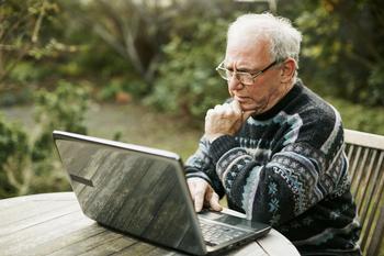 Working in Retirement? Here's Why That's Great... and Why It's Really Not: https://g.foolcdn.com/editorial/images/688120/older-man-laptop-outdoors_gettyimages-1350592597.jpg