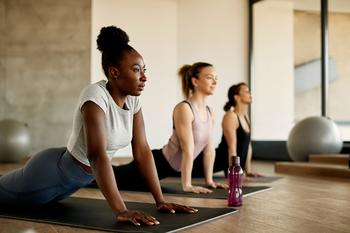 Better Growth Stock to Buy: Lululemon vs. Nike: https://g.foolcdn.com/editorial/images/746557/yoga-stretching-working-out-health-exercise.jpg