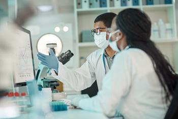 Why Novartis Stock Topped the Market on Tuesday: https://g.foolcdn.com/editorial/images/774065/two-people-seated-at-a-lab-desk-featuring-a-pc-screen-and-microscope.jpg