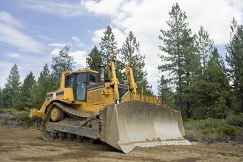 Why Caterpillar and Deere Outpaced the Market on Tuesday: https://g.foolcdn.com/editorial/images/736230/bulldozer-grating-forest-trees.jpg