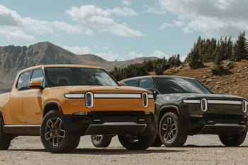 Tesla Rolls Out the Cybertruck. Is Rivian Finished?: https://g.foolcdn.com/editorial/images/740342/two-rivian-pickups.jpg