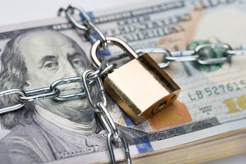 3 Safe Dividend Stocks to Beat Inflation: https://g.foolcdn.com/editorial/images/751608/chain-and-padlock-wrapped-around-stack-of-100-dollar-bills-cash-money-locked-up.jpeg