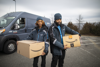 Forget Shopify: This Stock Has Made Far More Millionaires: https://g.foolcdn.com/editorial/images/771302/amazon-workers-with-packages.png