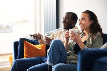 Walmart Is Now Competing With...Roku?: https://g.foolcdn.com/editorial/images/765448/two-people-sitting-on-a-couch-watching-streaming.jpg