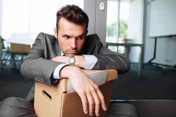 Lost Your Job? Here's the One Thing You Don't Want to Do With Your 401(k).: https://g.foolcdn.com/editorial/images/765623/young-businessman-with-desk-packed-into-cardboard-box-fired-from-job-terminated-worker-layoff-laid-off.jpg