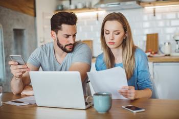 When Do Student Loan Payments Resume? 5 Surefire Ways to Prepare: https://g.foolcdn.com/editorial/images/736551/young-couple-looking-over-finances-at-home.jpg