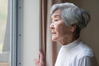 4 Reasons You Can't Live Off Social Security Alone in Retirement: https://g.foolcdn.com/editorial/images/730384/senior-woman-looking-outside-care-facility.jpg