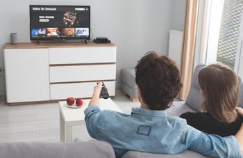 Is Roku Stock a Buy Now?: https://g.foolcdn.com/editorial/images/742509/couple-streaming-tv-living-room.jpg