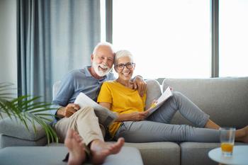 3 Financial Matters You and Your Spouse Must Discuss Before You Retire: https://g.foolcdn.com/editorial/images/760727/senior-couple-smiling-on-couch-gettyimages-1202951876.jpg