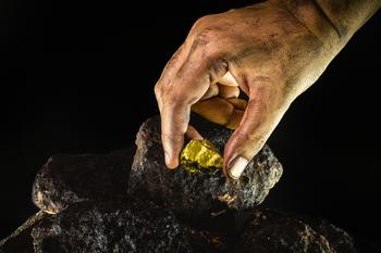 Is It Time to Buy April's Worst-Performing Nasdaq Stocks?: https://g.foolcdn.com/editorial/images/775897/miner-picks-up-gold-nugget-from-dirty-ore.jpg