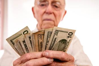 3 High-Yielding ETFs That Retirees Will Love: https://g.foolcdn.com/editorial/images/845945/person-holding-several-10-dollar-bills.jpg