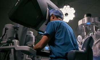 Should You Buy Shares of Intuitive Surgical In October?: https://g.foolcdn.com/editorial/images/836381/surgeon-using-intutive-surgical-davinci-robot-headset-console_intuitive.jpg