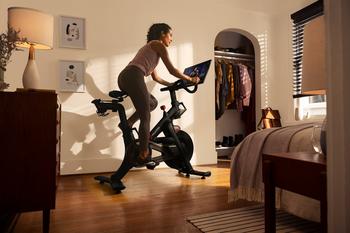 1 Growth Stock to Buy, and 1 to Sell During the S&P 500 Bull Market: https://g.foolcdn.com/editorial/images/778940/a-person-using-their-peloton-exercise-bike-in-their-bedroom.jpg