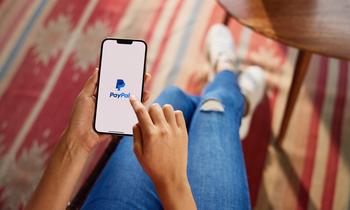 What Is Going On With PayPal Stock?: https://g.foolcdn.com/editorial/images/768769/person-holding-phone-with-paypal-app-3_paypal.jpg