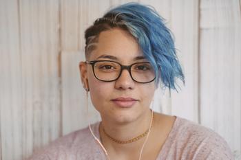Read This Article Before Dropping Out of College – Your Wallet Will Thank You: https://g.foolcdn.com/editorial/images/741022/getty-blue-hair-slight-smile-serious-millennial.jpg