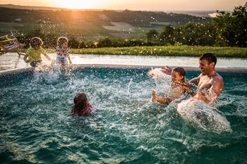 This Growth Stock Is Ready to Make a Splash in Your Portfolio: https://g.foolcdn.com/editorial/images/687881/family-enjoying-swimming-pool-at-sunset.jpg