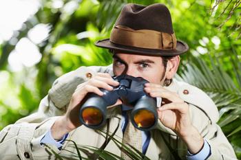 Netflix's Password-Sharing Ideas Are Not New: https://g.foolcdn.com/editorial/images/687786/detective-with-binoculars-hiding-in-a-bush.jpg