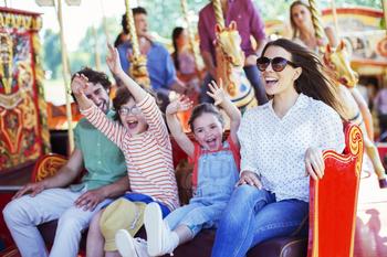 1 Iconic Stock Down 55% to Buy Now: https://g.foolcdn.com/editorial/images/736832/family-on-carousel-in-amusement-park.jpg