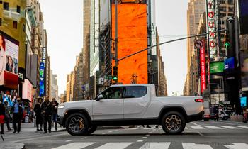 With Rivian Stock Surging, Is It a Buy Before 2025 Ends?: https://g.foolcdn.com/editorial/images/846225/truck-in-middle-of-time-square_rivian.jpg