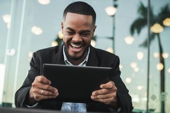 T-Mobile: Here Comes the Monster Buyback: https://g.foolcdn.com/editorial/images/700321/man-smiles-at-tablet-outside.jpg
