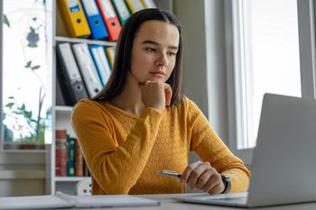 Biden's Backup Student Loans Plan: How Long Could His Plan B Take?: https://g.foolcdn.com/editorial/images/740163/young-woman-looking-at-laptop.jpg