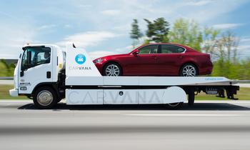 After Skyrocketing 800% in the Past 12 Months, Is It Time to Buy Carvana Stock?: https://g.foolcdn.com/editorial/images/767083/car-on-_carvana-delivery-truck-with-logo_carvana.jpg
