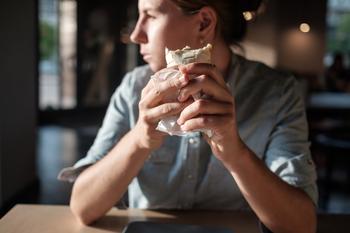 3 Investing Lessons from Billionaire Bill Ackman's Ownership of Chipotle Stock: https://g.foolcdn.com/editorial/images/778209/customer-looks-on-while-eating-burrito.jpg
