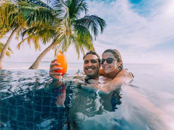 This SPAC Stock Could Be the Next Big Thing for Travel Investors: https://g.foolcdn.com/editorial/images/689737/couple-relaxes-in-pool-at-a-beach-setting.jpg