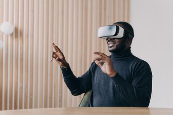 Apple's Vision Pro Is Here: 1 Major Reason Tim Cook Missed the Mark: https://g.foolcdn.com/editorial/images/735206/person-controlling-a-vr-headset-with-gestures-and-smiling.jpg