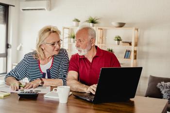 3 Times It Pays to Claim Social Security Before Full Retirement Age: https://g.foolcdn.com/editorial/images/749115/senior-couple-laptop-gettyimages-1194939334.jpg