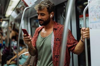 Why Airbnb Stock Jumped This Week: https://g.foolcdn.com/editorial/images/721279/traveler-using-mobile-phone-while-riding-a-subway-train.jpg