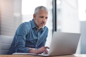 2 Ways Working Longer Can Help You Score a Higher Social Security Benefit: https://g.foolcdn.com/editorial/images/745862/older-man-laptop-a-person-at-a-laptop_gettyimages-623192890.jpg