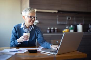 How to 10X Your Retirement Savings While Barely Lifting a Finger: https://g.foolcdn.com/editorial/images/708936/older-person-looking-at-a-laptop-and-smiling.jpg