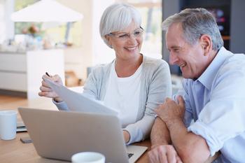 Enrolling in Medicare? 3 Things You Need to Know.: https://g.foolcdn.com/editorial/images/719928/senior-couple-smiling-laptop-gettyimages-495809094.jpg