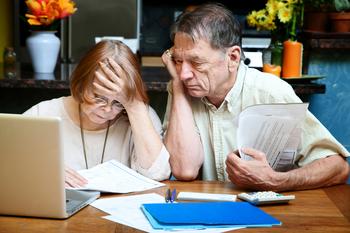 Even Young People Are Worried About Running Out of Money in Retirement. Are You?: https://g.foolcdn.com/editorial/images/774418/senior-couple-worried-looking-at-bills-finances-debt.jpg