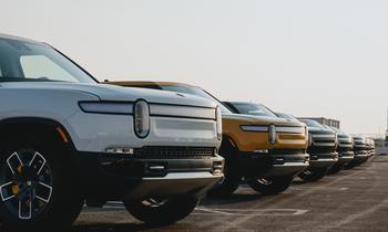 Beyond the Road: Exploring the Impact of a Potential Rivian-Apple Collaboration: https://g.foolcdn.com/editorial/images/776724/line-of-_rivian-trucks-in-parking-lot_rivian.jpg