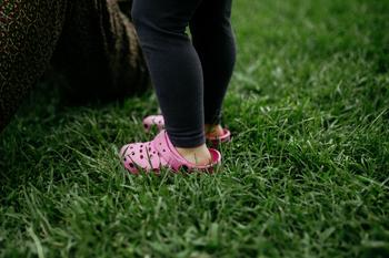 Is This 1 Thing the Biggest Risk for Crocs Stock?: https://g.foolcdn.com/editorial/images/766129/wearing-pink-crocs-standing-in-grass.jpg