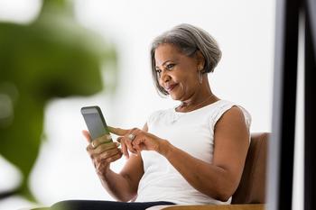This Real Estate Stock Is a Must-Own for Any Dividend Investor: https://g.foolcdn.com/editorial/images/699366/older-woman-phone-smile-facetime-app.jpg