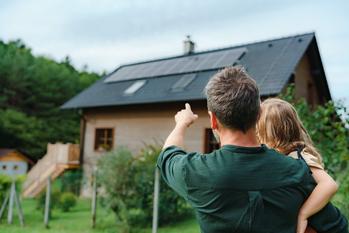 Why SunPower Stock Climbed 8% Higher This Week: https://g.foolcdn.com/editorial/images/759710/adult-with-child-in-arms-pointing-to-a-house-with-solar-panels-on-its-roof.jpg