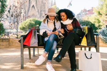 Why Visa Stock Gained 11% in January: https://g.foolcdn.com/editorial/images/719259/two-people-sitting-on-a-bench-wearing-coats-and-hats-with-shopping-bags-looking-at-a-mobile-phone.jpg