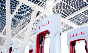 Tesla Is Unlikely to Launch $25,000 Model: https://g.foolcdn.com/editorial/images/775309/group-of-tesla-super-chargers-with-logo-in-view.png